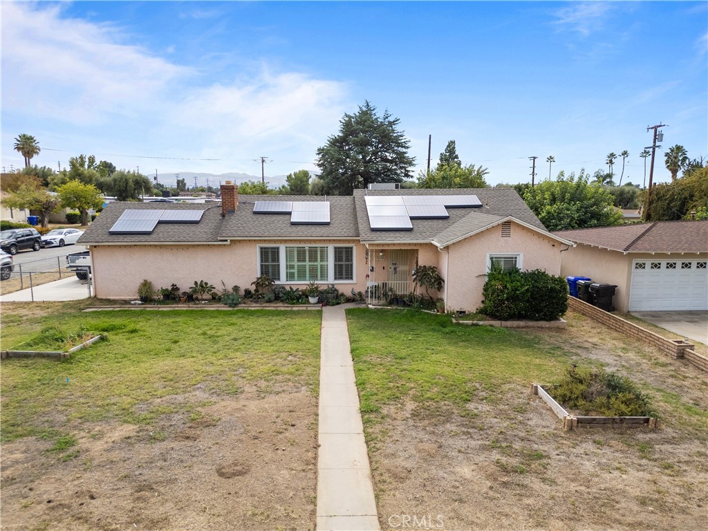 1555 Toluca Drive East San Bernardino, CA 92404 - Photo 1 of 13 a view of a house with a yard
