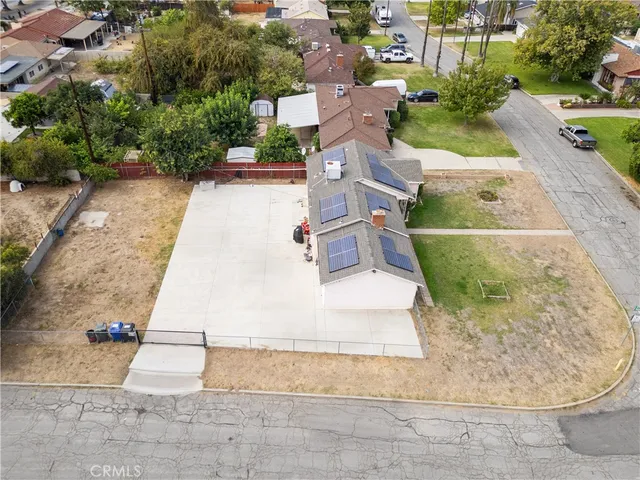 an aerial view of a house with a yard and garage