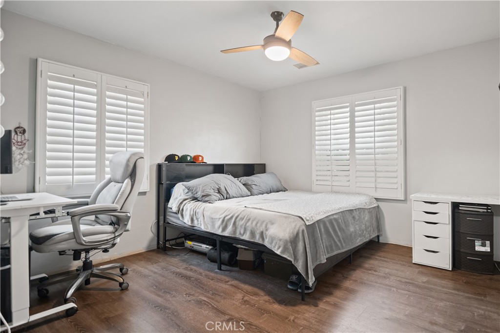 1555 Toluca Drive East San Bernardino, CA 92404 - Photo 10 of 13 a bed room with a bed and a chair