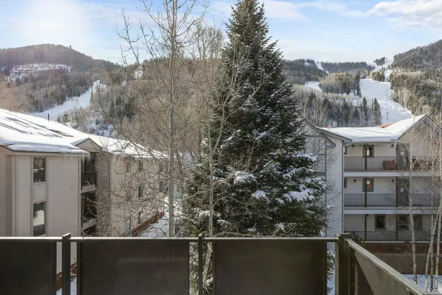 a view of a balcony with an outdoor seating