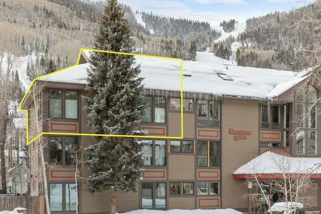 a view of a house with yard and sitting area