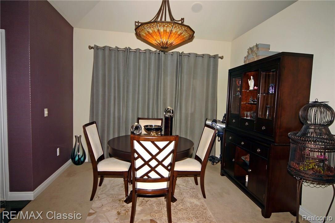 A beautiful dining room with a custom chandelier.