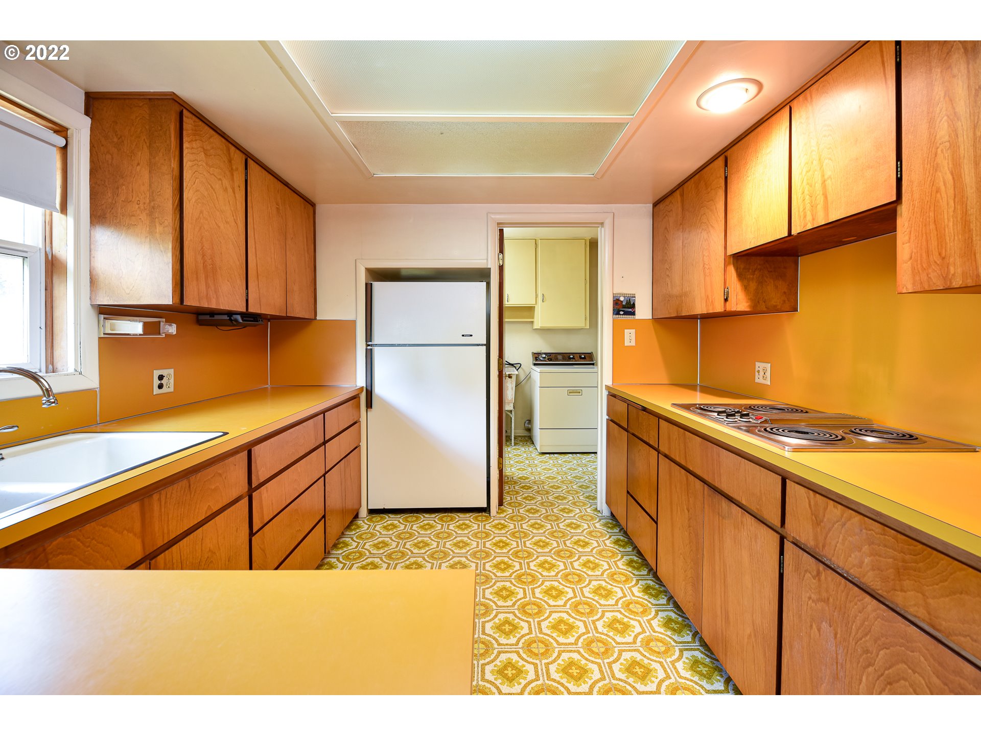 2308 Don Street Springfield, OR 97477 - Photo 11 of 30 a kitchen with stainless steel appliances granite countertop a sink and a refrigerator