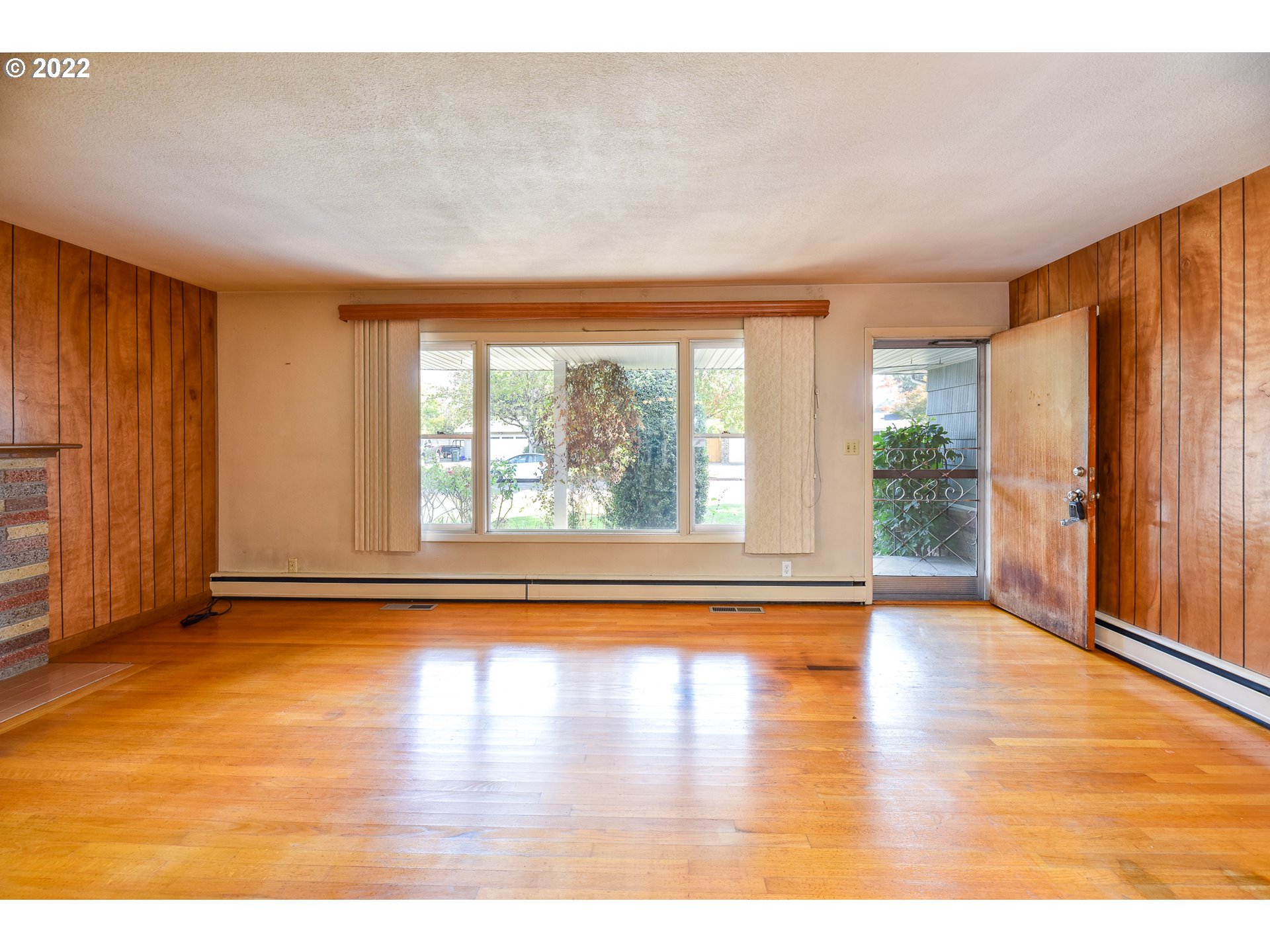 2308 Don Street Springfield, OR 97477 - Photo 3 of 30 a view of empty room with wooden floor and fan