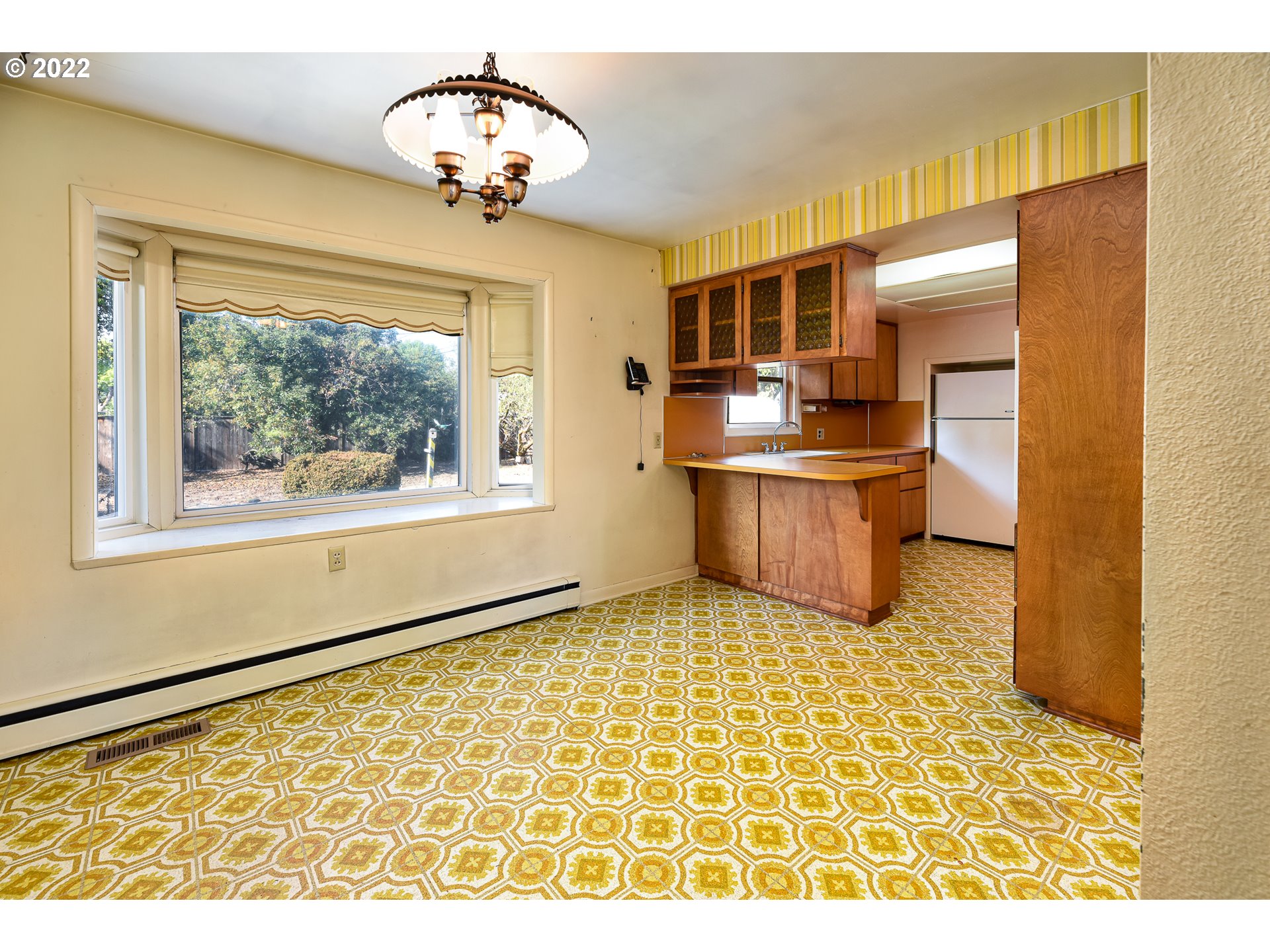 2308 Don Street Springfield, OR 97477 - Photo 8 of 30 a view of a kitchen with a sink and a refrigerator