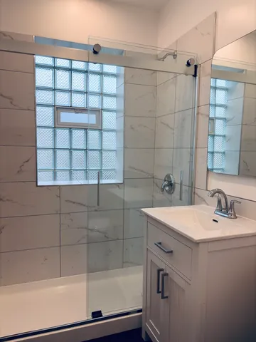 a bathroom with a sink and a shower
