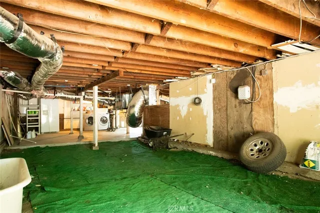 a view of a house with a yard and sitting area