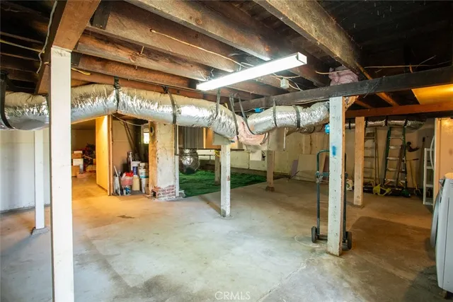 a view of a hallway with entryway wooden floor and front door