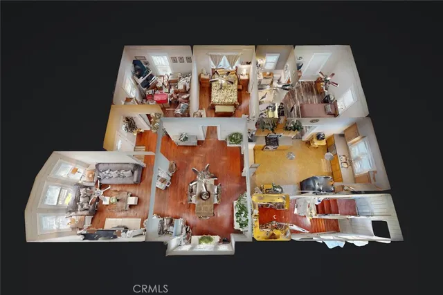 a dining room with furniture potted plants and wooden floor