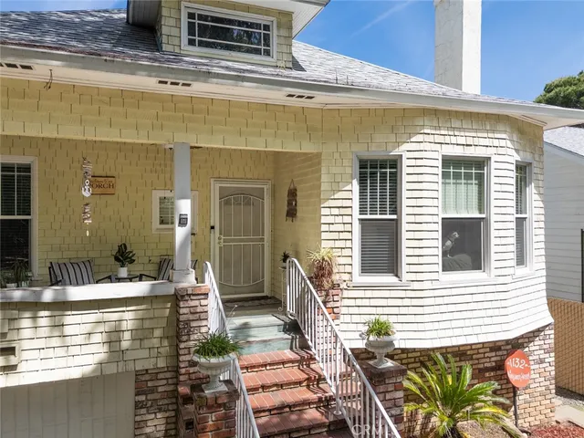 a view of a patio with couches chairs and potted plants