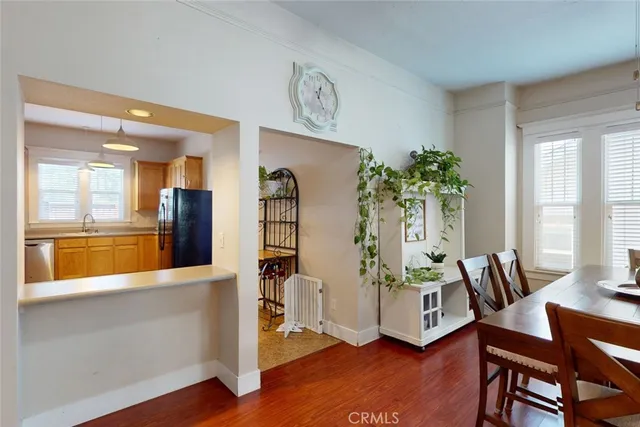 a room with lots of furniture and a book shelf