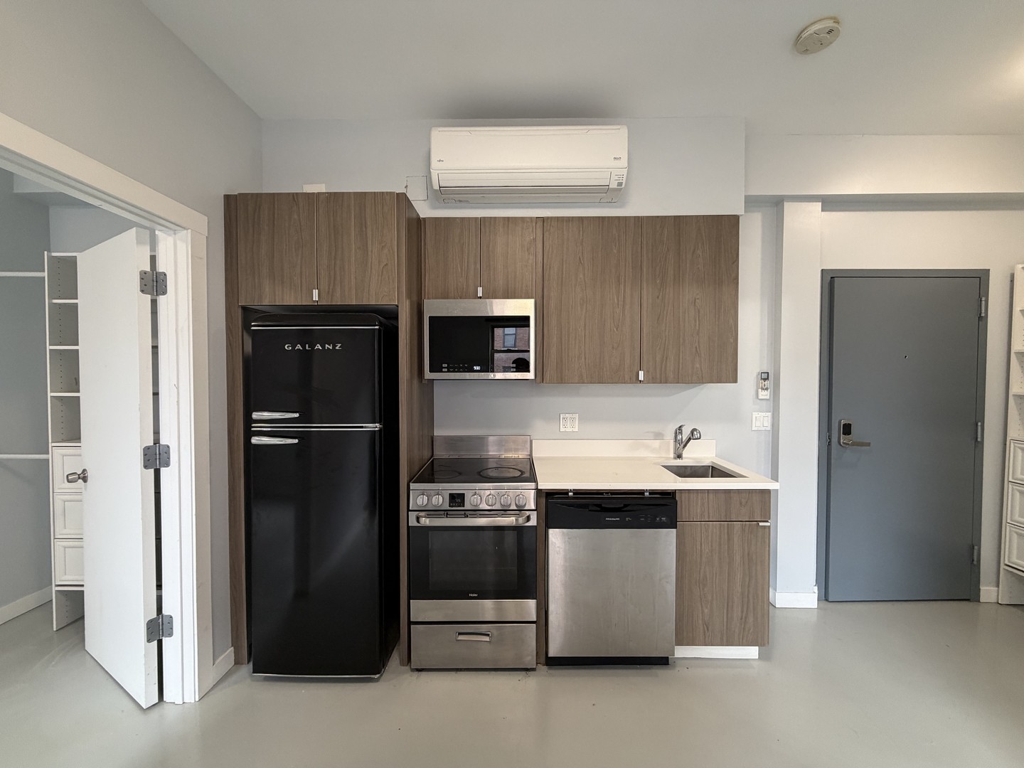 4700 North Racine Avenue, Unit 316 Chicago, IL 60640 - Photo 2 of 6 a kitchen with stainless steel appliances a refrigerator and a sink