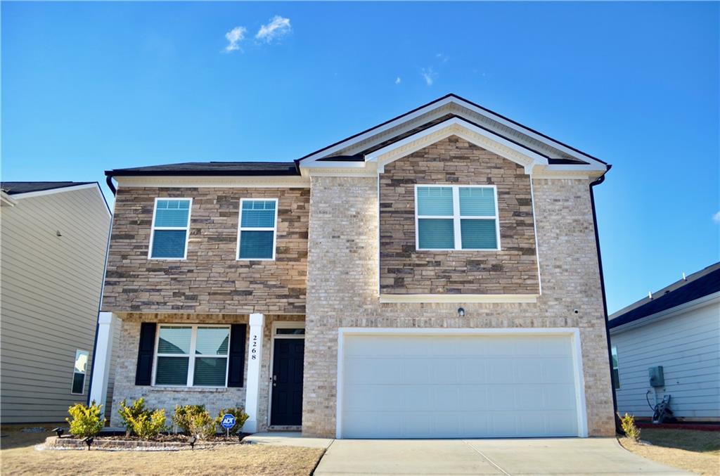 2268 Redfern Road Dacula, GA 30019 - Photo 1 of 1 a front view of a house with a yard