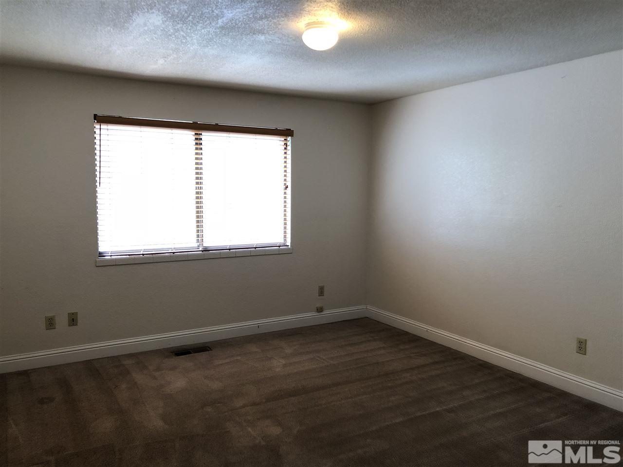 2230 Trentham Way Reno, NV 89509 - Photo 6 of 14 an empty room with a window