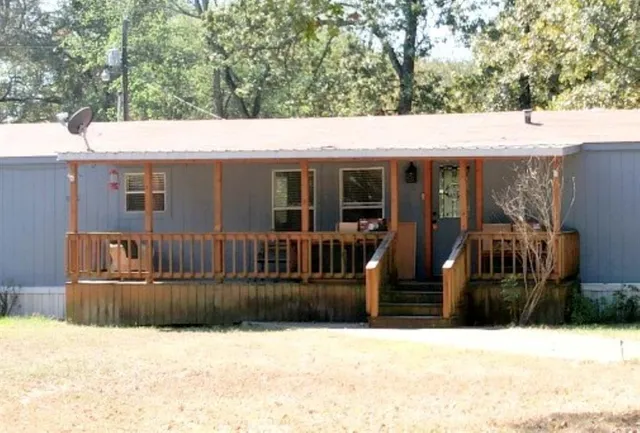 a bedroom with a bed and a television