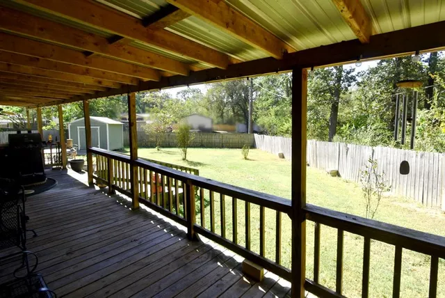 a backyard of a house with basket ball court and a stove