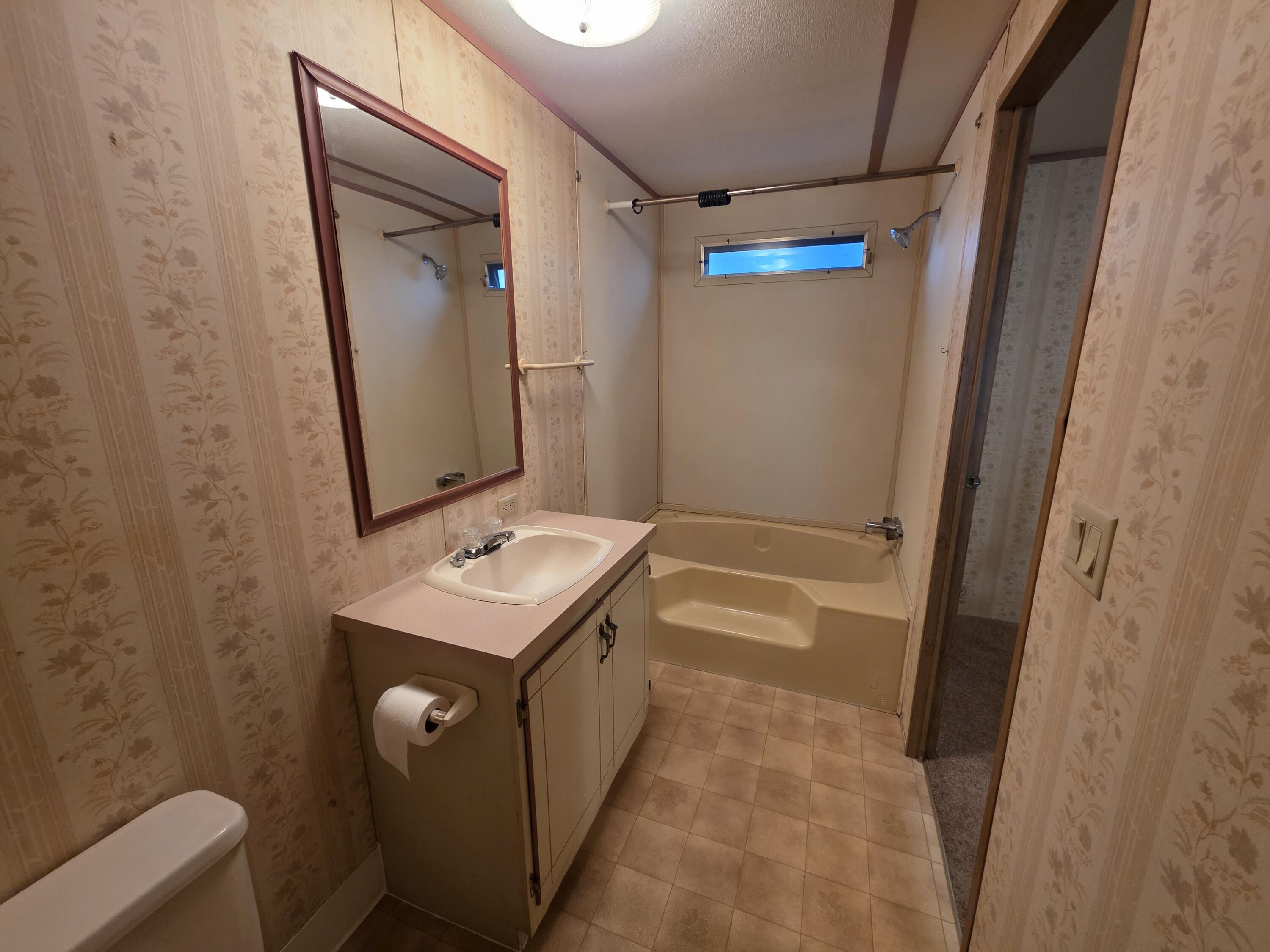 301 Freeman Road, Unit 30 Central Point, OR 97502 - Photo 7 of 26 a bathroom with a sink and a mirror