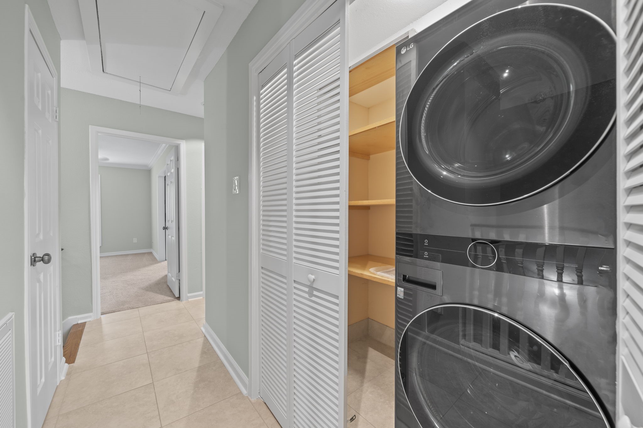 5801 Lumberdale Road, Unit 132 Houston, TX 77092 - Photo 16 of 33 Laundry room with built-in storage and full-size washer & dryer