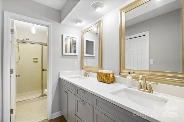 2707 Quailrush Road Charlotte, NC 28226 - Photo 19 of 29 a bathroom with a granite countertop sink and a mirror