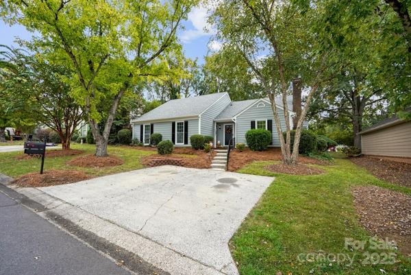 2707 Quailrush Road Charlotte, NC 28226 - Photo 2 of 29 a front view of a house with yard and green space