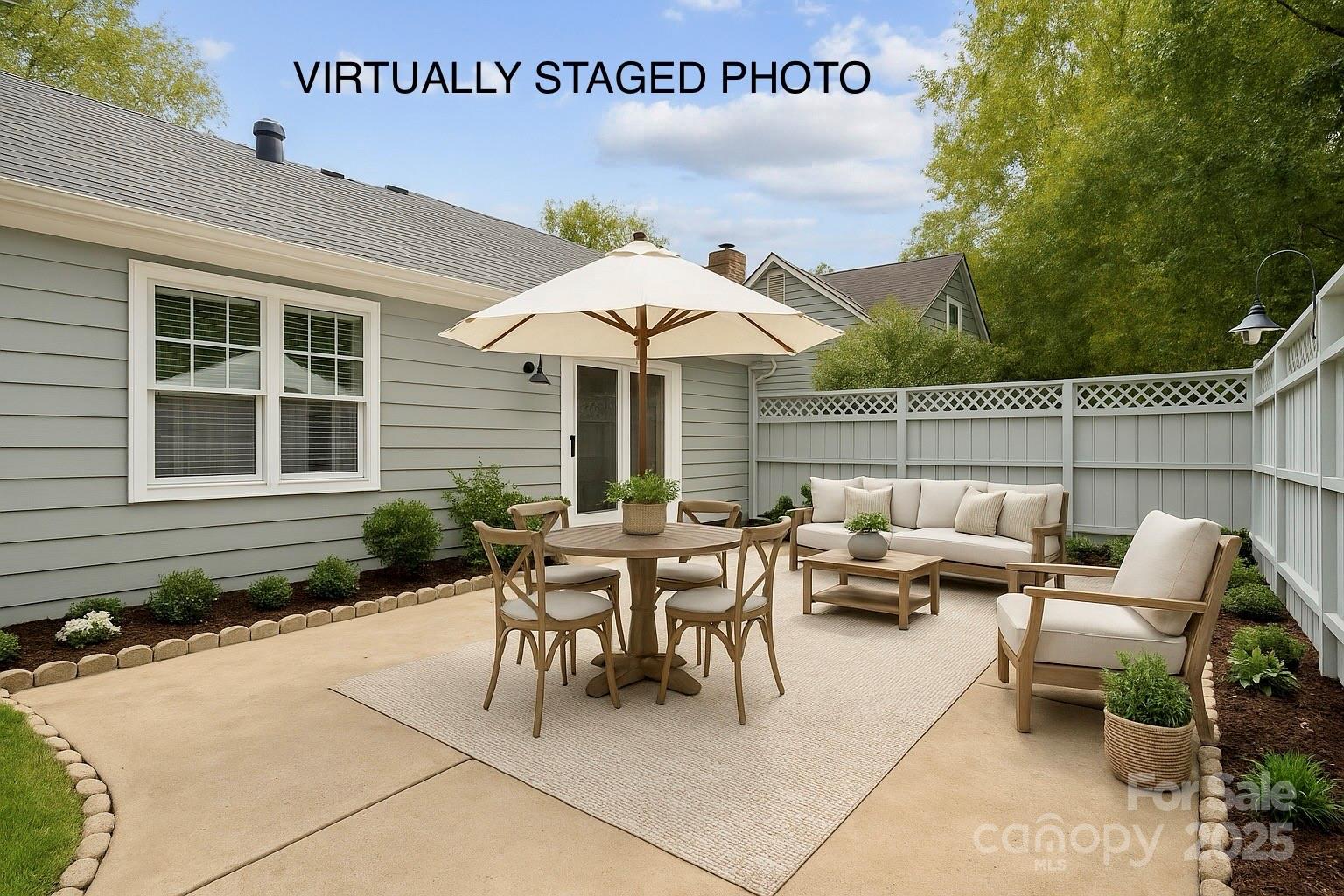 2707 Quailrush Road Charlotte, NC 28226 - Photo 26 of 29 a backyard of a house with table and chairs