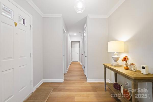 2707 Quailrush Road Charlotte, NC 28226 - Photo 4 of 29 a view of a livingroom with wooden floor and chandelier
