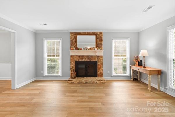2707 Quailrush Road Charlotte, NC 28226 - Photo 5 of 29 a view of an empty room with a window and fireplace
