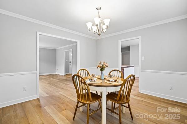 2707 Quailrush Road Charlotte, NC 28226 - Photo 9 of 29 a dining room with furniture and chandelier