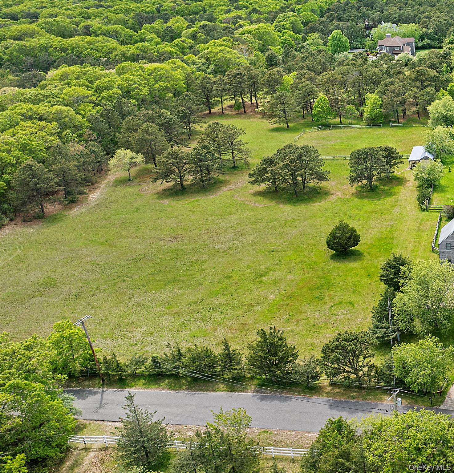 144 Damascus Road East Quogue, NY 11942 - Photo 3 of 4 a view of an ocean with boats and trees all around
