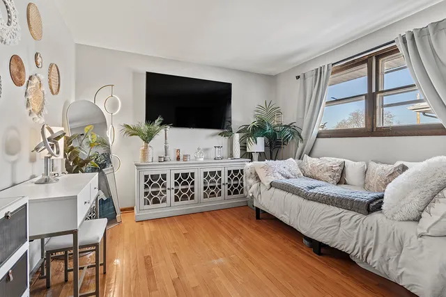 a living room with furniture fireplace and flat screen tv