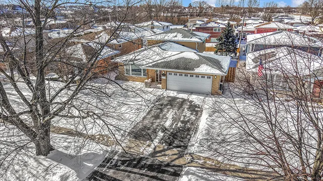an aerial view of residential houses with yard