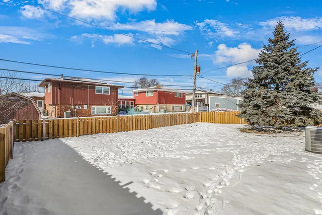 a view of a swimming pool with a yard