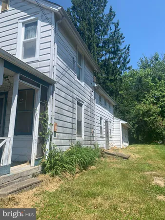 a house with trees in front of it