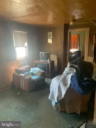 a bedroom with bed and window