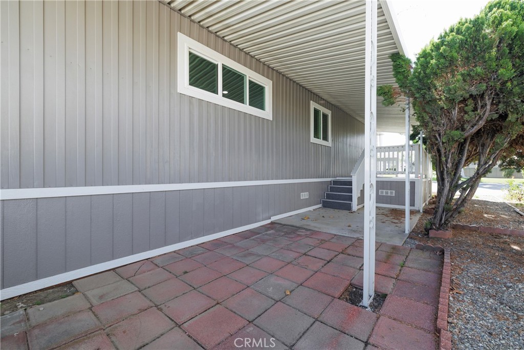 3700 Buchanan Street, Unit 131 Corona, CA 92503 - Photo 22 of 27 a view of backyard with tub and trees