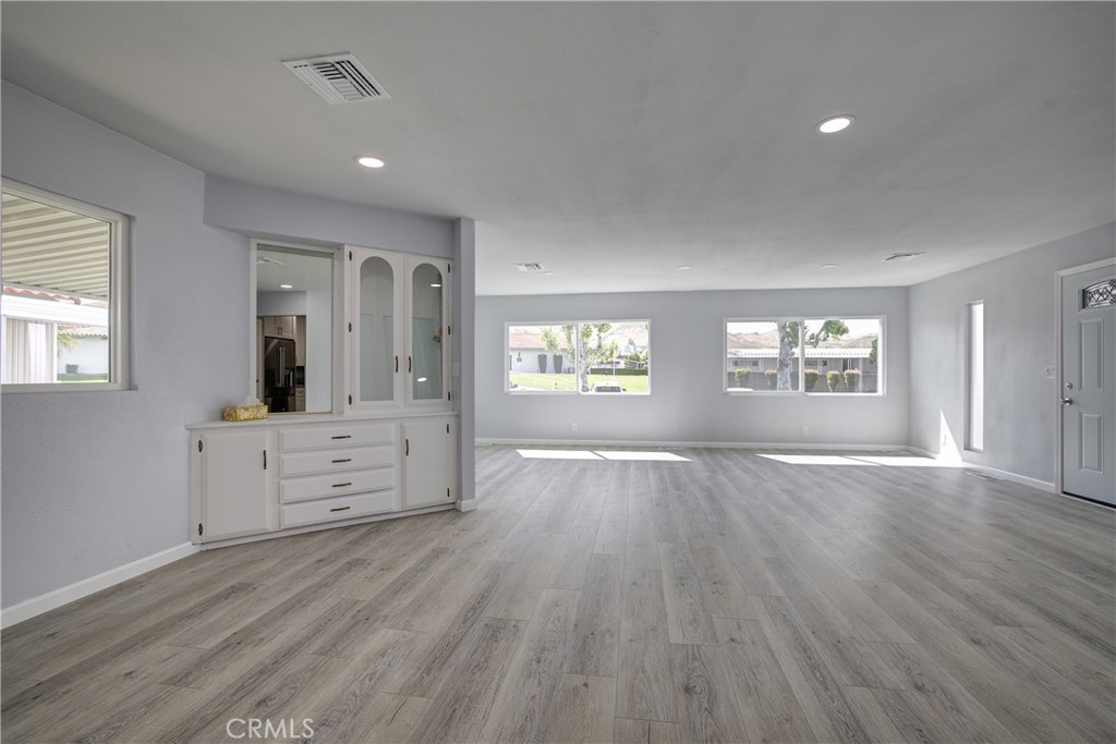 3700 Buchanan Street, Unit 131 Corona, CA 92503 - Photo 7 of 27 wooden floor in an empty room with a window