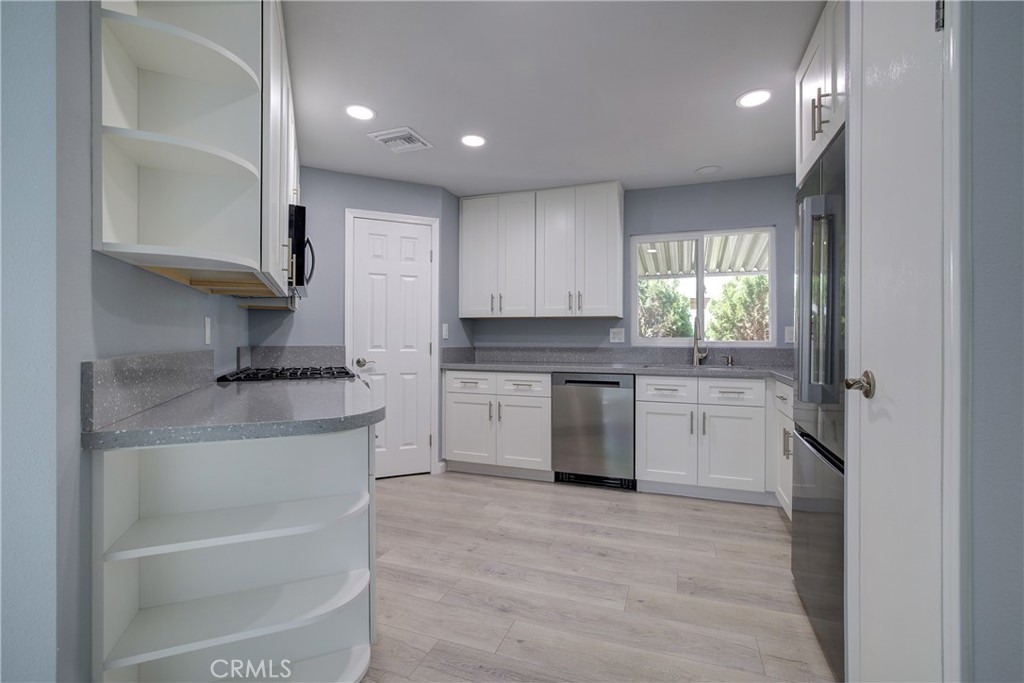 3700 Buchanan Street, Unit 131 Corona, CA 92503 - Photo 10 of 27 a kitchen with a sink cabinets and window