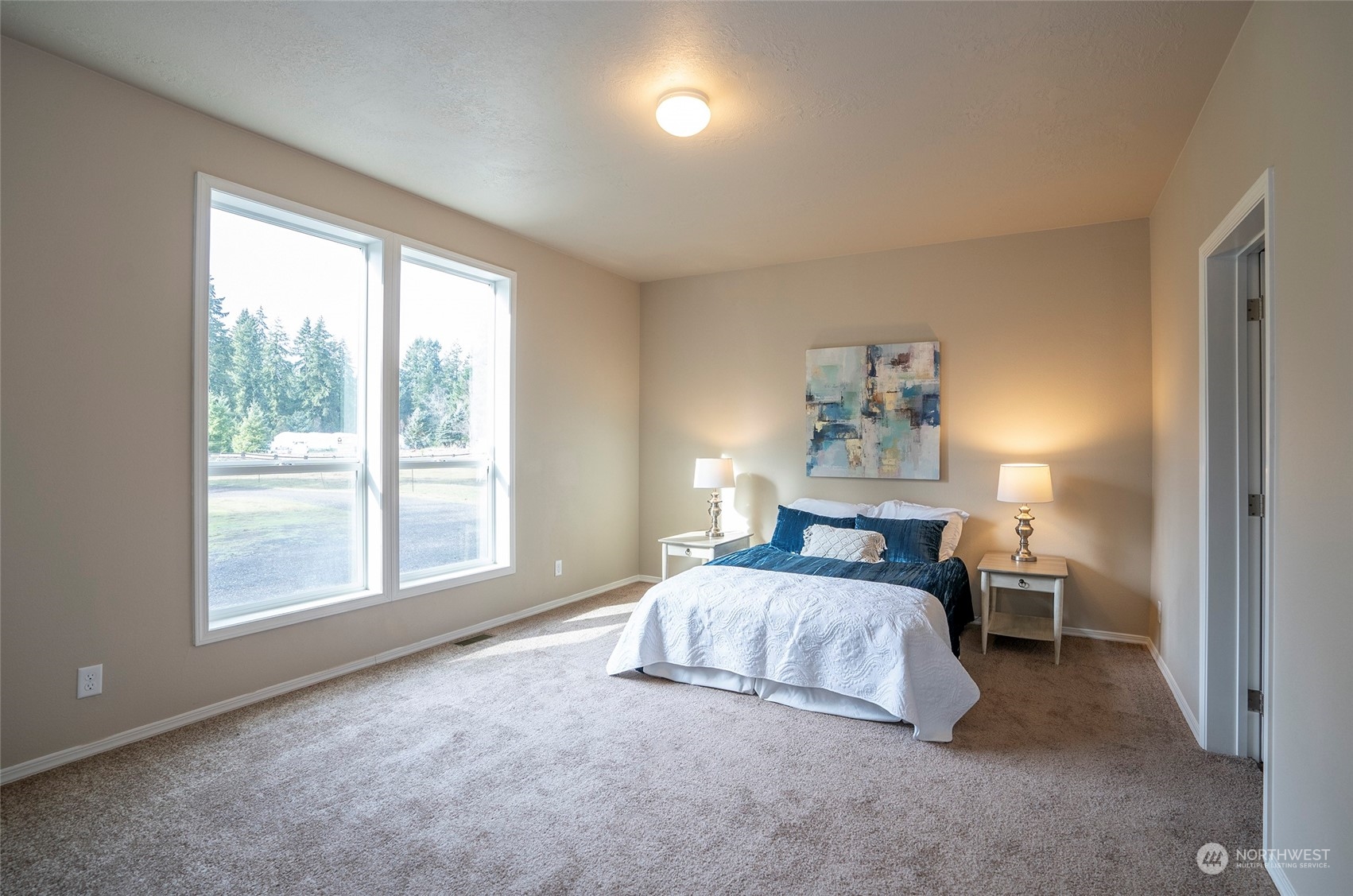 17202 Shantra Lane Southwest Rochester, WA 98579 - Photo 23 of 40 a bedroom with a bed and a window