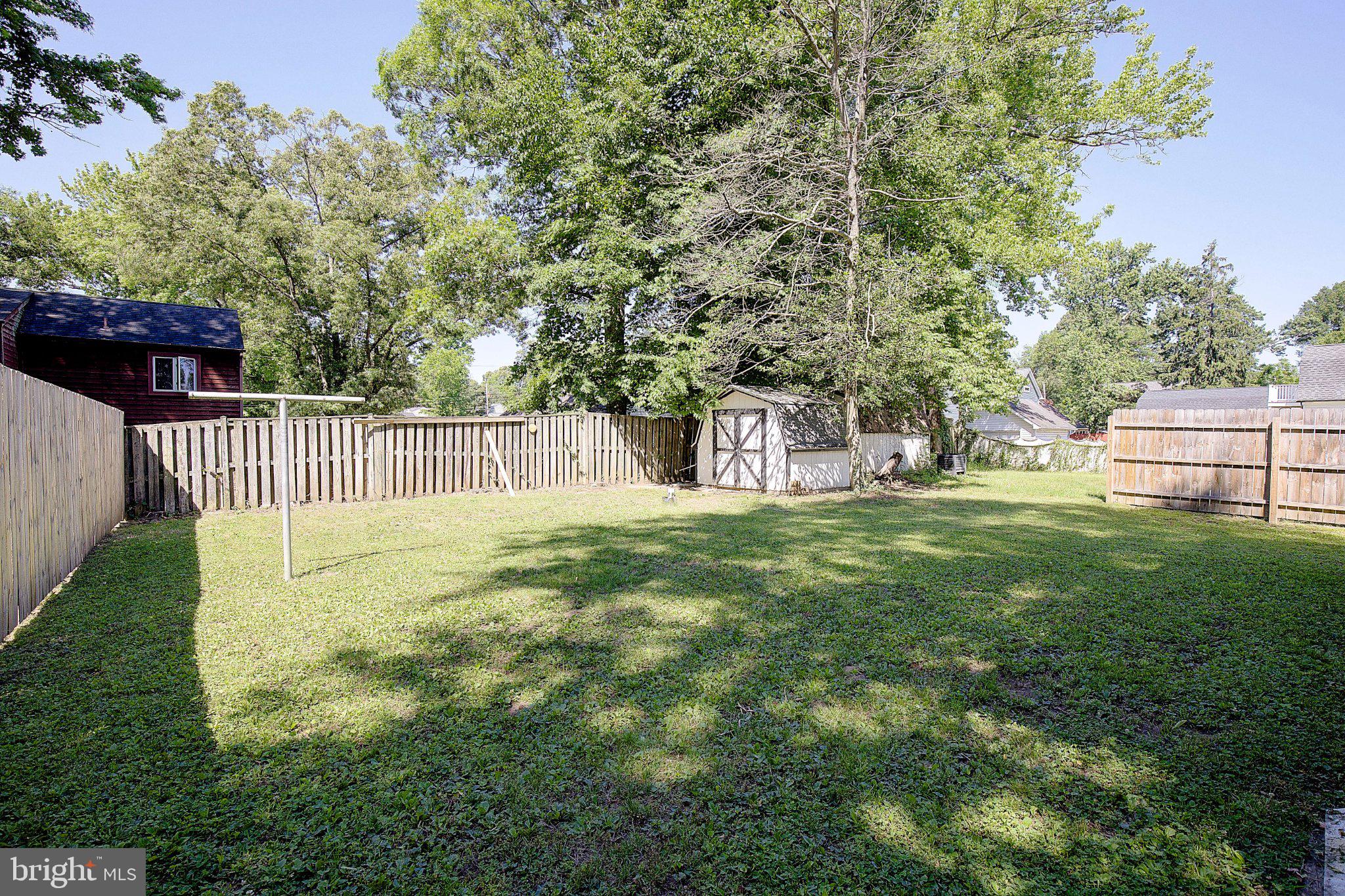 1718 Ridgely Road Edgewater, MD 21037 - Photo 15 of 19 Spacious backyard with lush greenery.