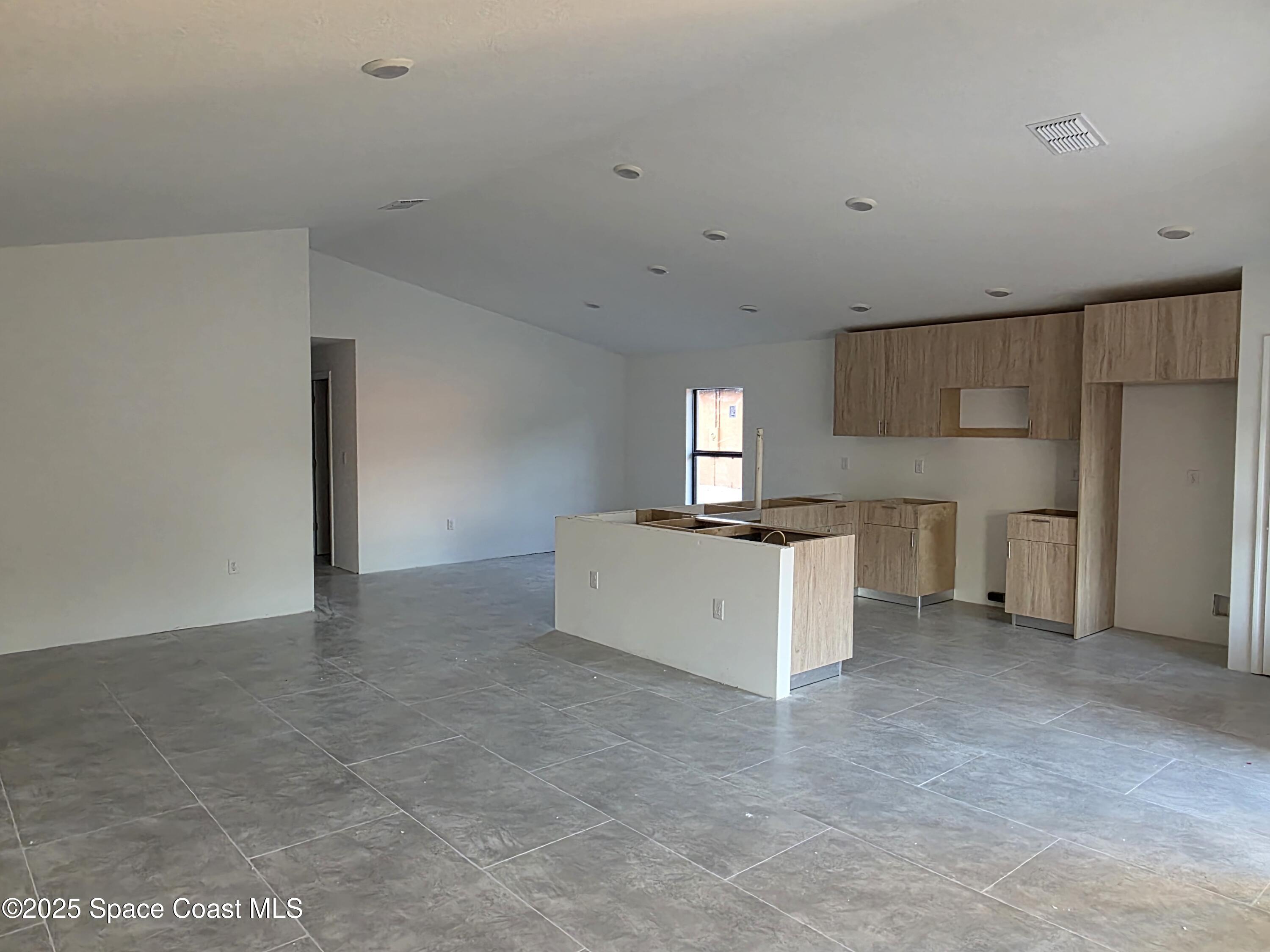 1659 Javier Street, Unit AB Palm Bay, FL 32909 - Photo 25 of 37 a view of an empty room with a window