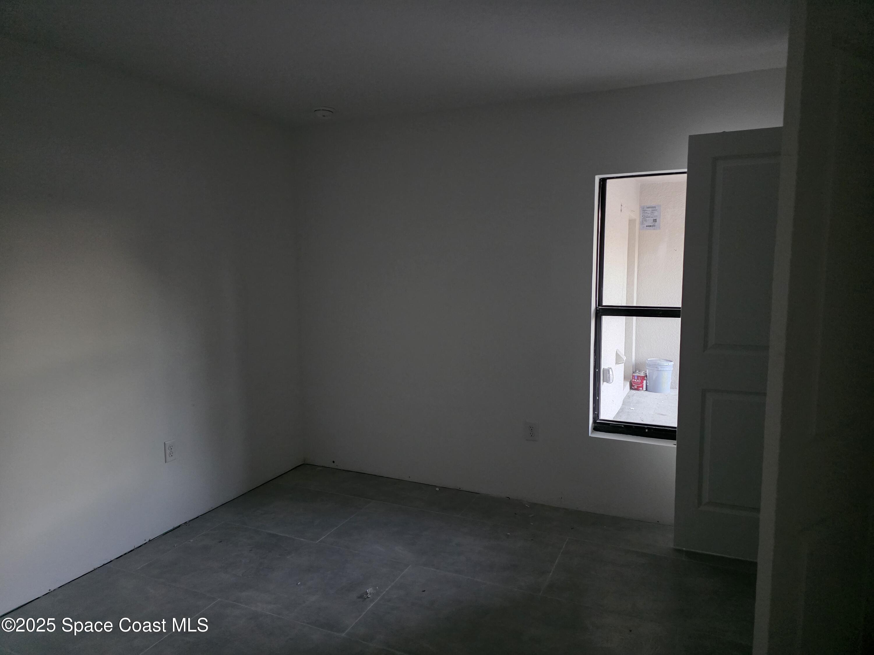 1659 Javier Street, Unit AB Palm Bay, FL 32909 - Photo 30 of 37 a view of an empty room and window