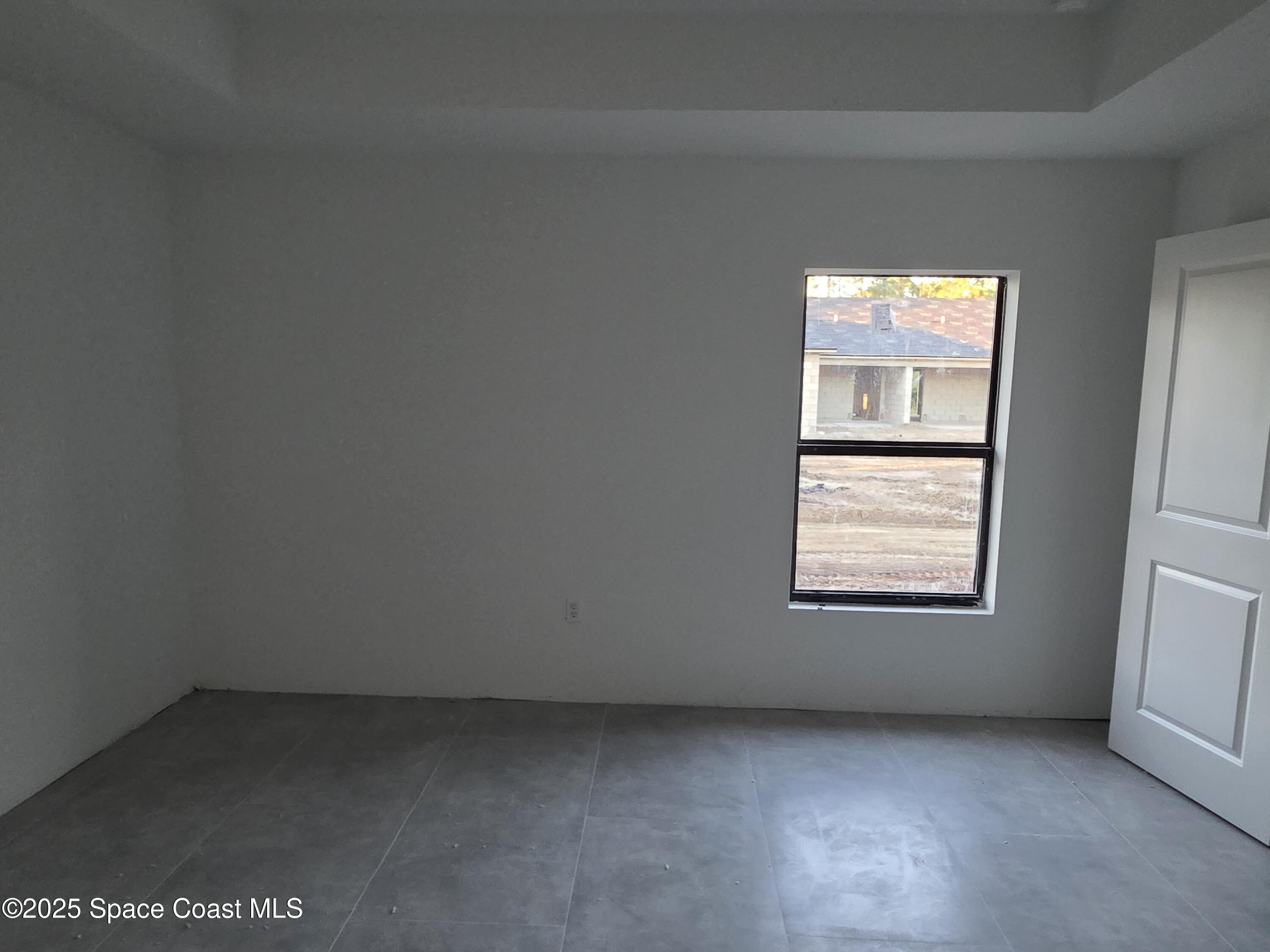 1659 Javier Street, Unit AB Palm Bay, FL 32909 - Photo 31 of 37 an empty room with a window