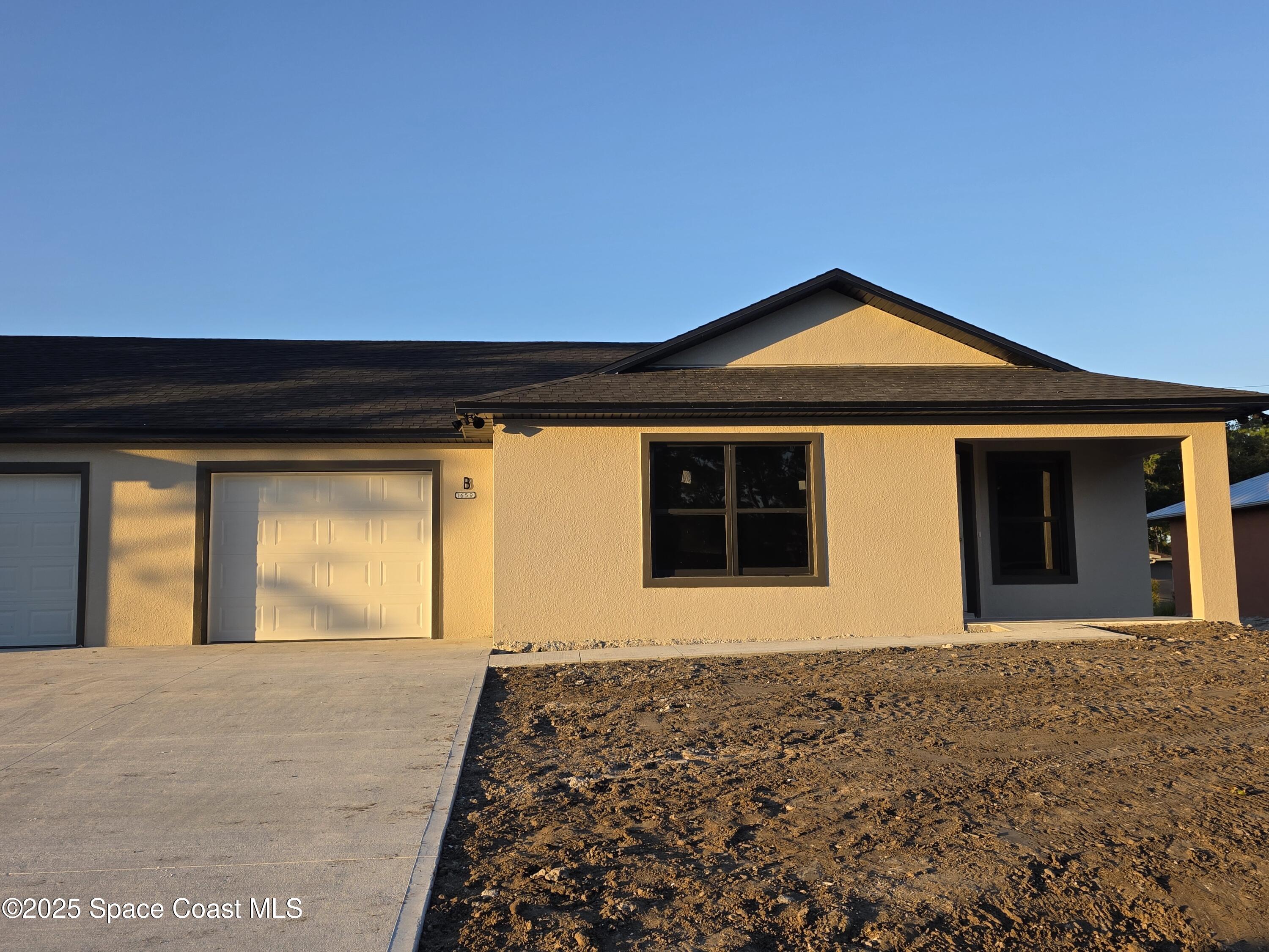 1659 Javier Street, Unit AB Palm Bay, FL 32909 - Photo 6 of 37 a front view of a house