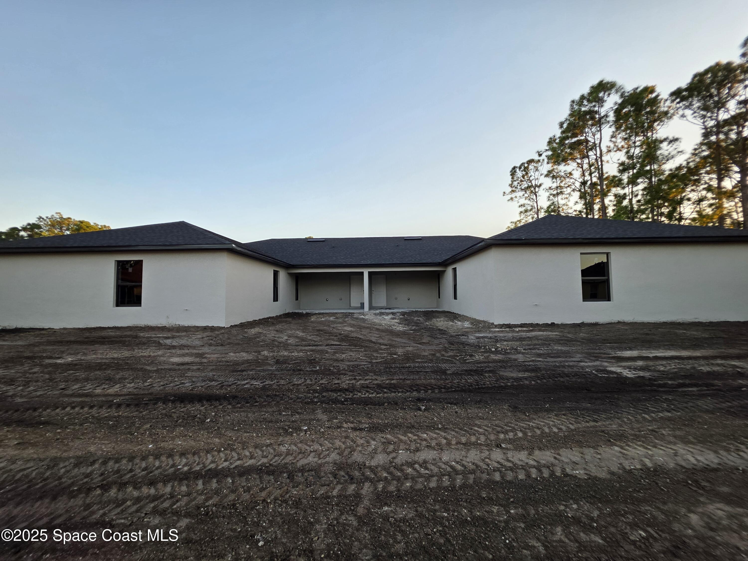 1659 Javier Street, Unit AB Palm Bay, FL 32909 - Photo 8 of 37 a view of a house with a yard