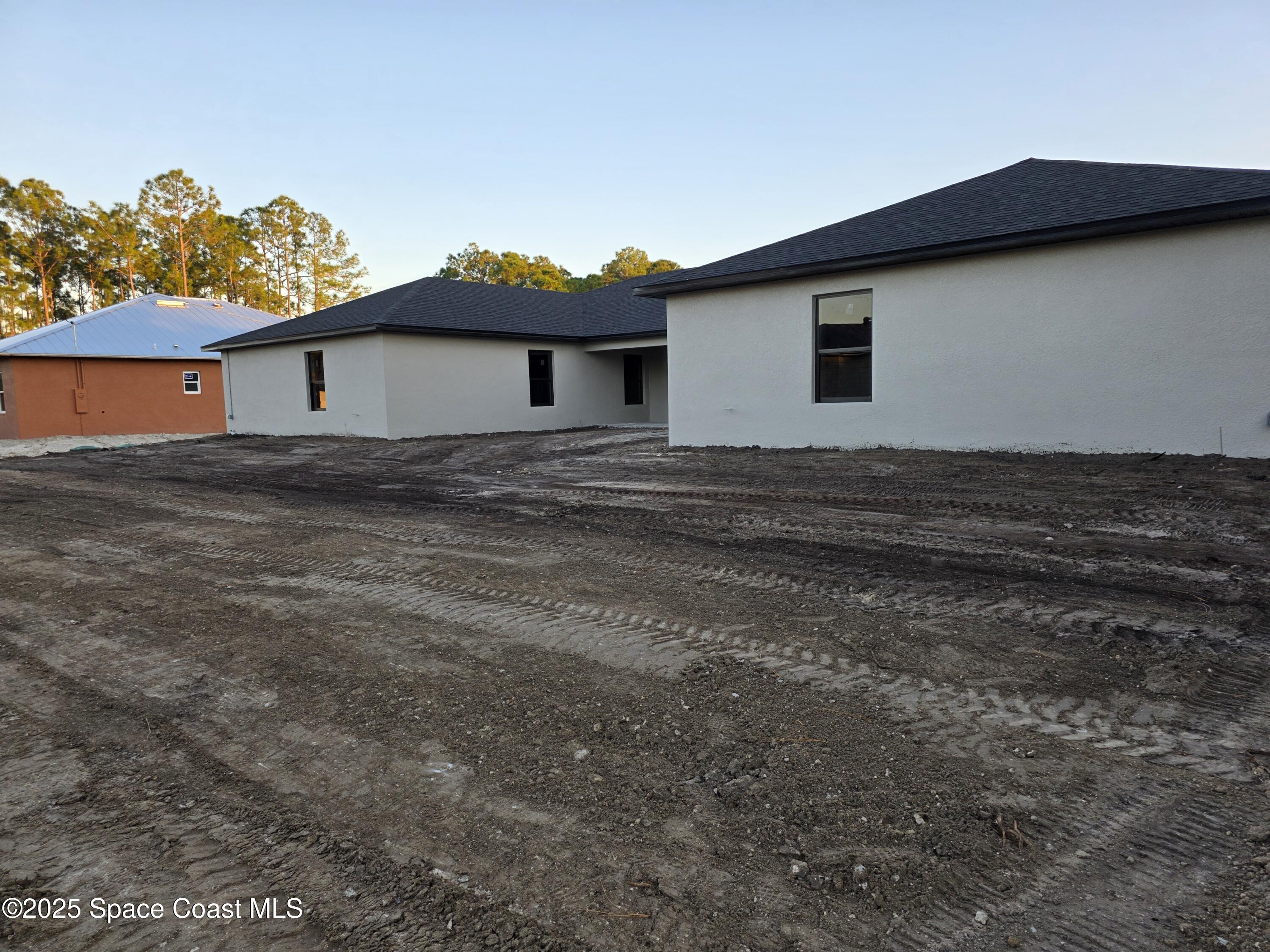 1659 Javier Street, Unit AB Palm Bay, FL 32909 - Photo 9 of 37 a view of a house with a yard