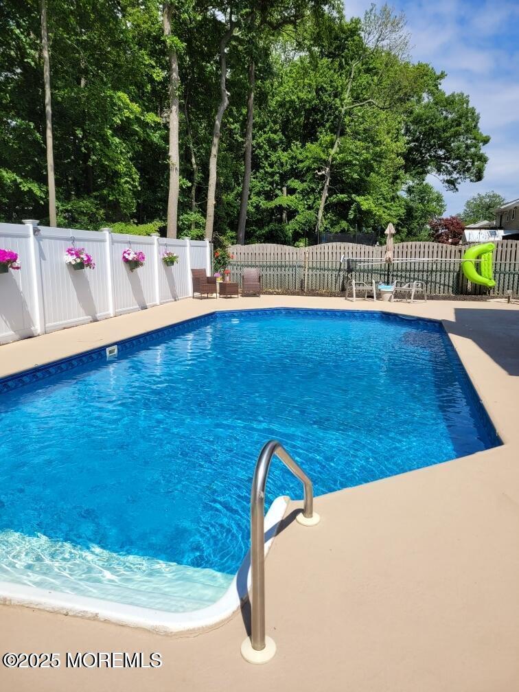 34 Hemlock Street Hazlet, NJ 07730 - Photo 28 of 30 a view of swimming pool with a sitting space