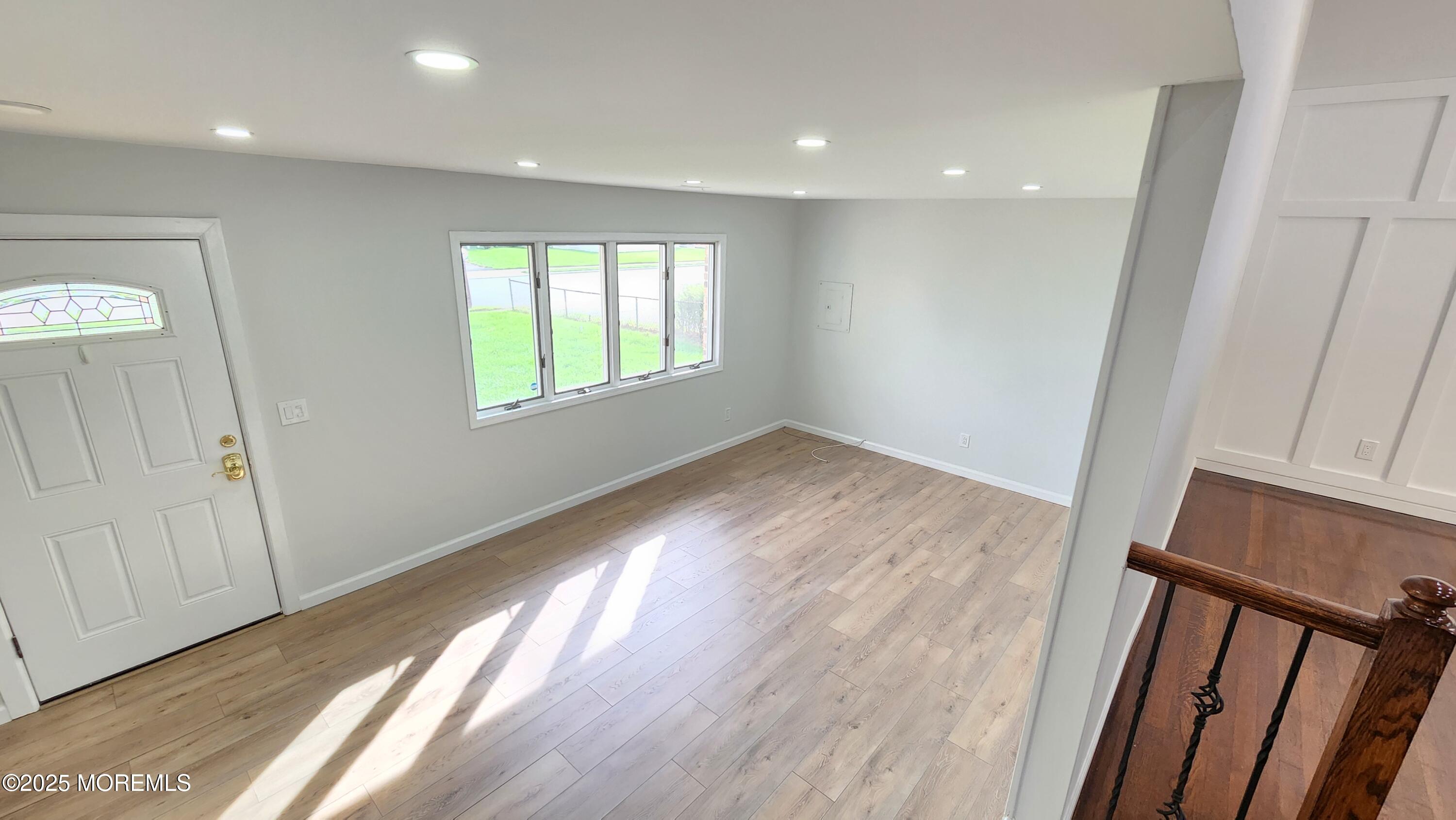 34 Hemlock Street Hazlet, NJ 07730 - Photo 3 of 30 a view of empty room with wooden floor and fan