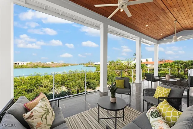 a balcony with furniture and garden view