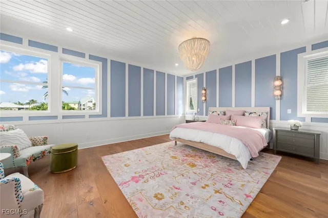 a bedroom with bed and window