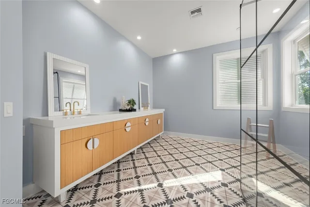 a kitchen with stainless steel appliances a refrigerator and a stove